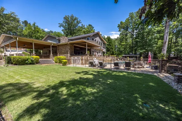 a view of backyard with sitting area and roof