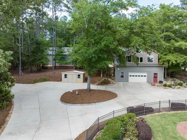 a house with swimming pool in front of it