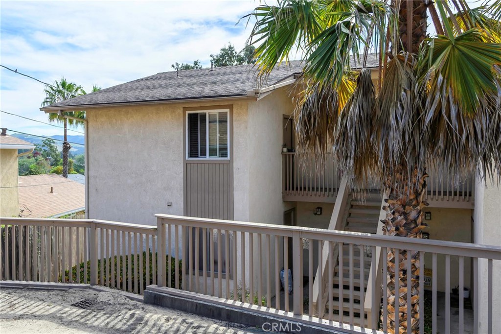 171 Brisco Road, Unit 8 Arroyo Grande, CA 93420 - Photo 16 of 23 a view of a wooden fence and a trees
