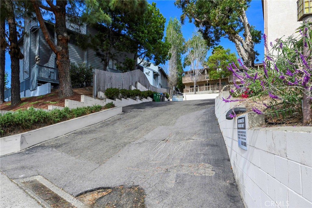 171 Brisco Road, Unit 8 Arroyo Grande, CA 93420 - Photo 22 of 23 a front view of a house with a yard and garage