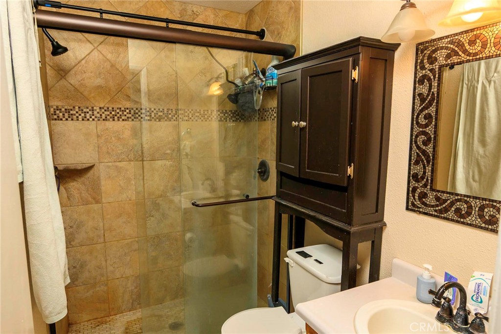 171 Brisco Road, Unit 8 Arroyo Grande, CA 93420 - Photo 5 of 23 a bathroom with a toilet and a shower