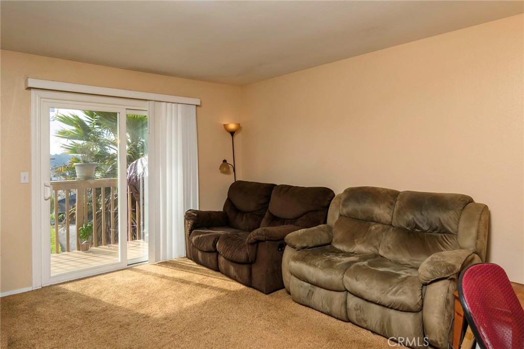 171 Brisco Road, Unit 8 Arroyo Grande, CA 93420 - Photo 5 of 16 Comfortable living room with carpet flooring