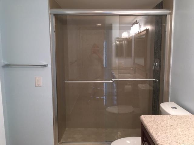 4154 Inverrary Drive, Unit 407 Lauderhill, FL 33319 - Photo 13 of 39 a bathroom with a granite countertop shower a toilet and sink