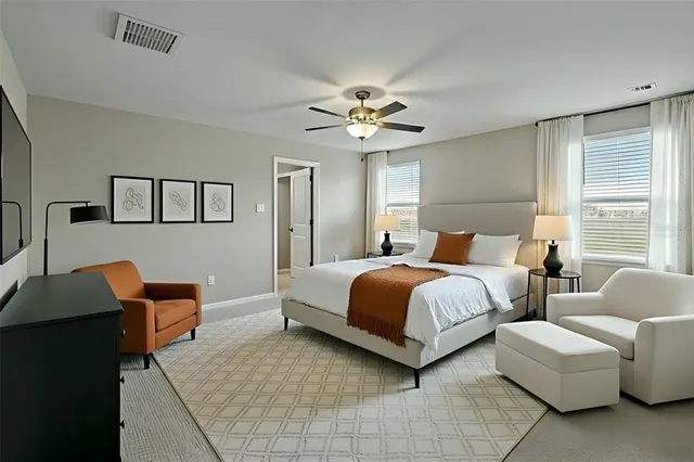 a bedroom with furniture and a chandelier