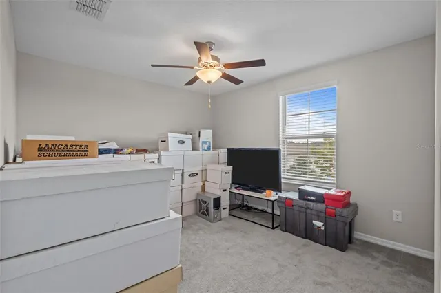 a room with furniture and a flat screen tv