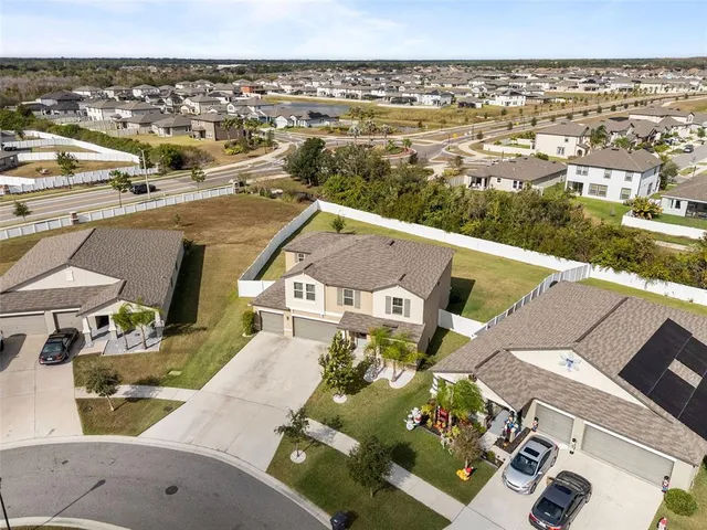 an aerial view of a house with a outdoor space