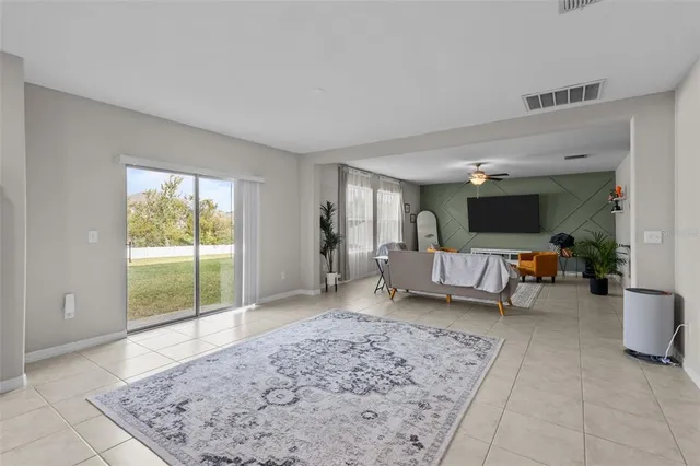 a living room with furniture and a rug