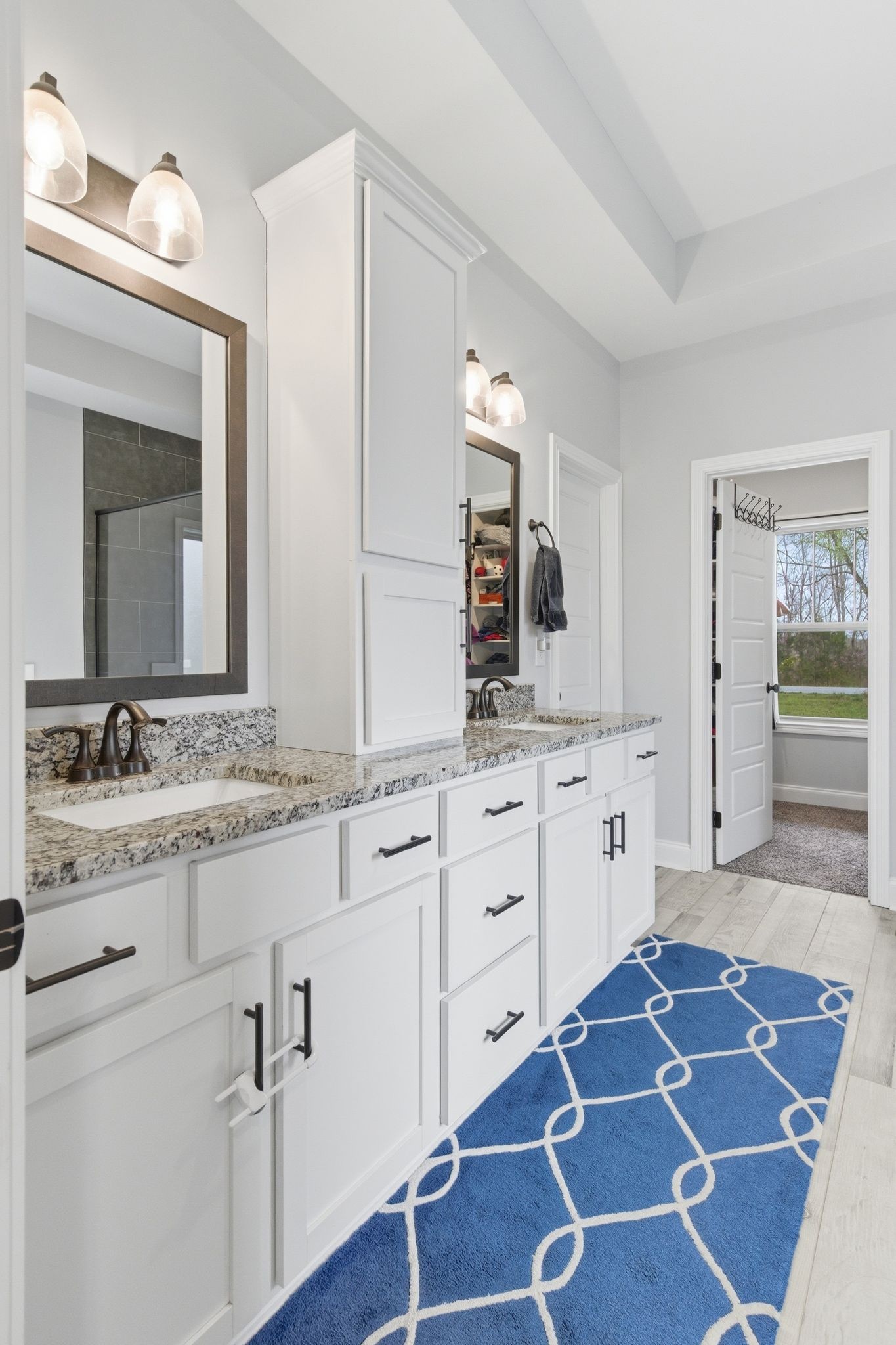 1166 Carney Winters Road Ashland City, TN 37015 - Photo 18 of 41 a spacious bathroom with a granite countertop sink and a mirror