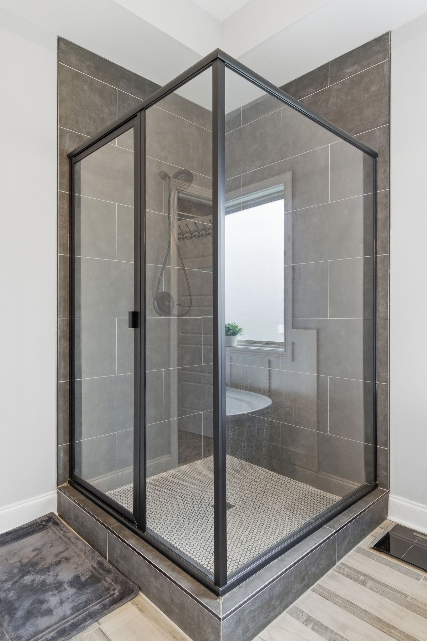 1166 Carney Winters Road Ashland City, TN 37015 - Photo 19 of 41 a bathroom with a glass shower door