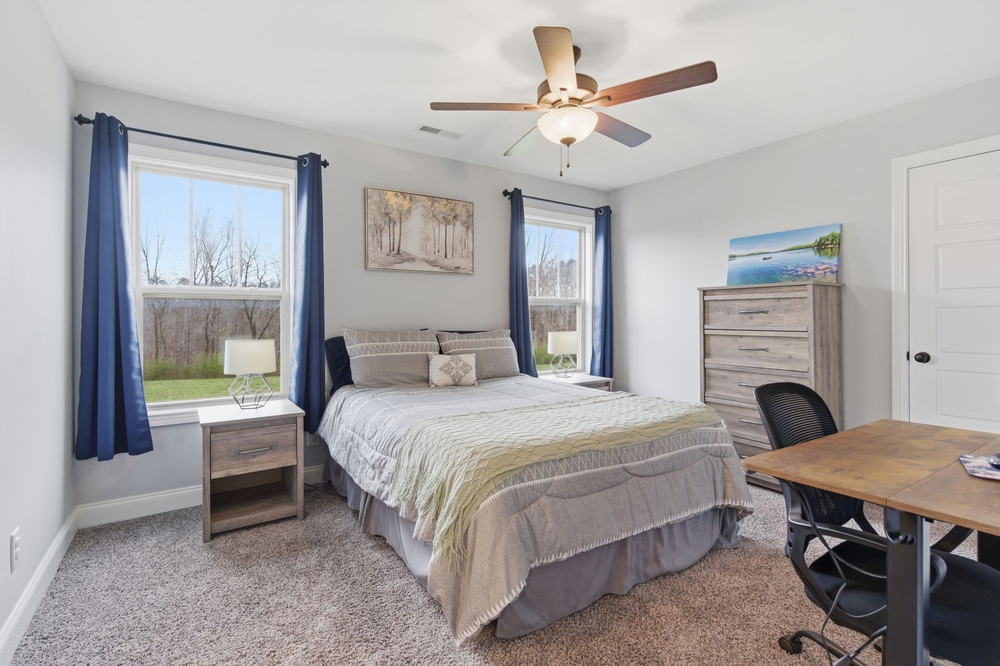 1166 Carney Winters Road Ashland City, TN 37015 - Photo 26 of 41 a bedroom with a bed and a table with chair