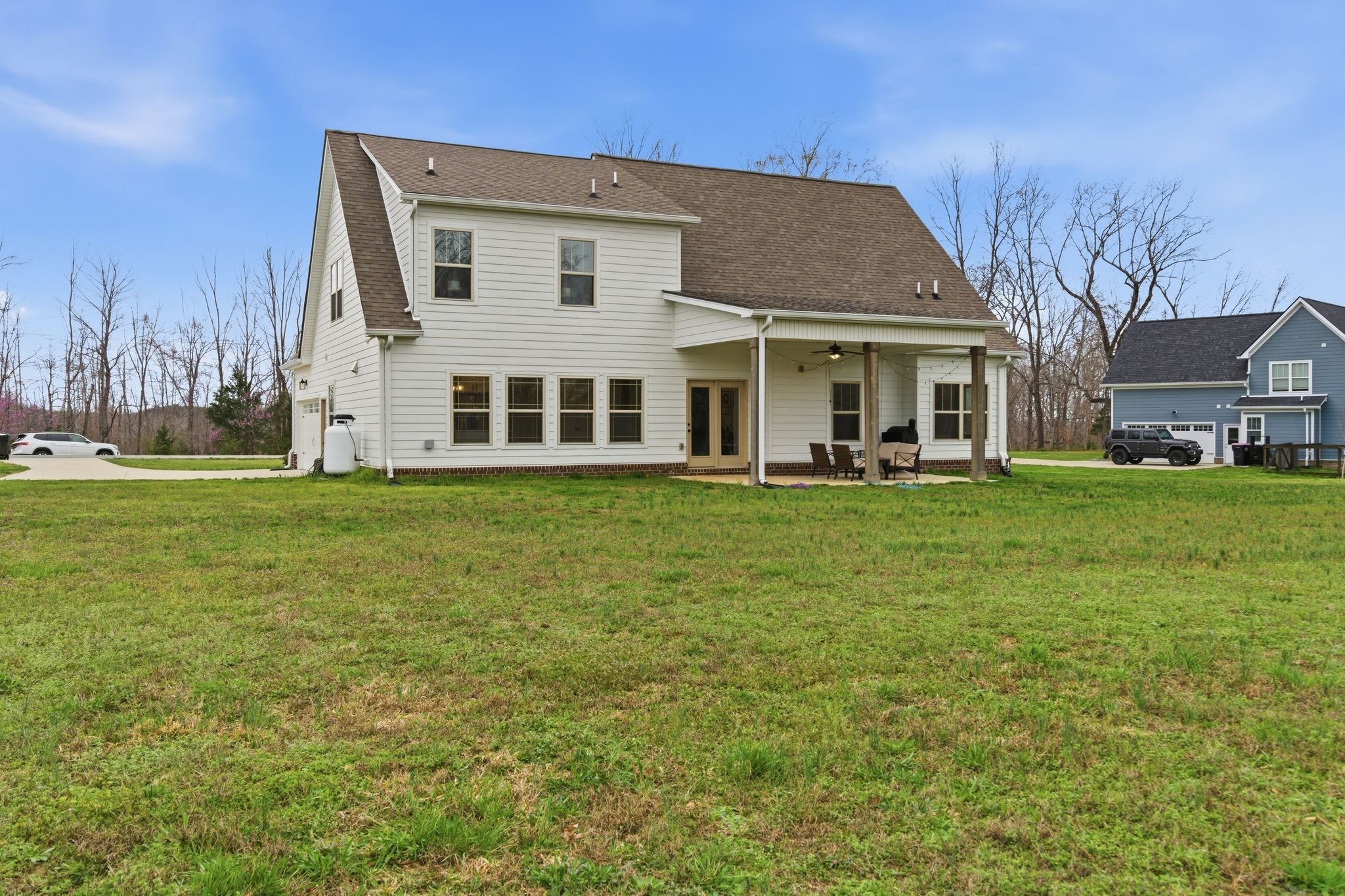 1166 Carney Winters Road Ashland City, TN 37015 - Photo 30 of 41 a front view of a house with a yard and trees