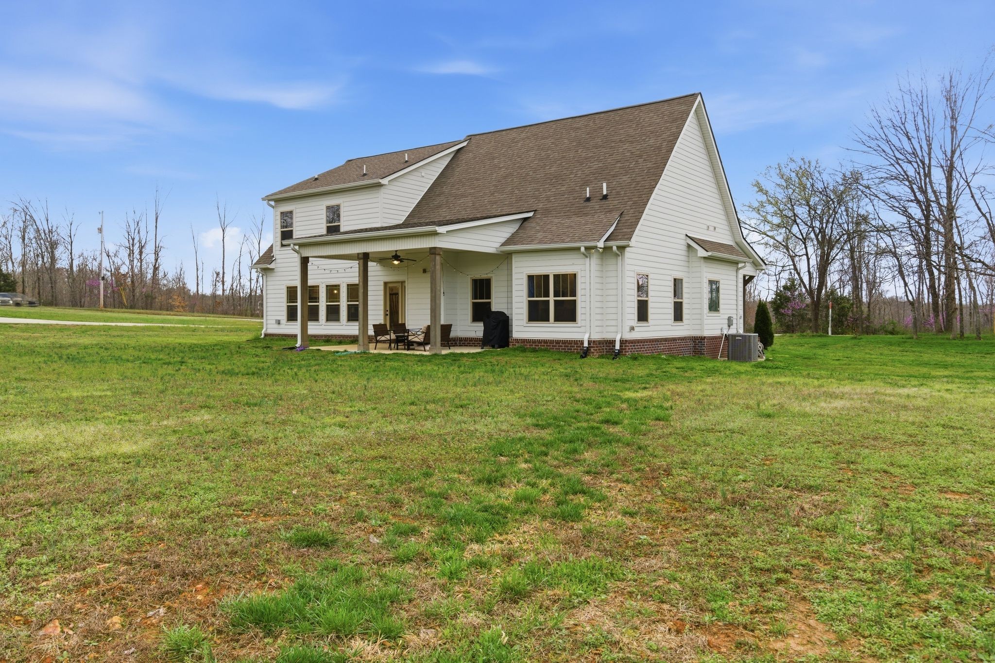 1166 Carney Winters Road Ashland City, TN 37015 - Photo 31 of 41 a view of a house with a big yard and large trees