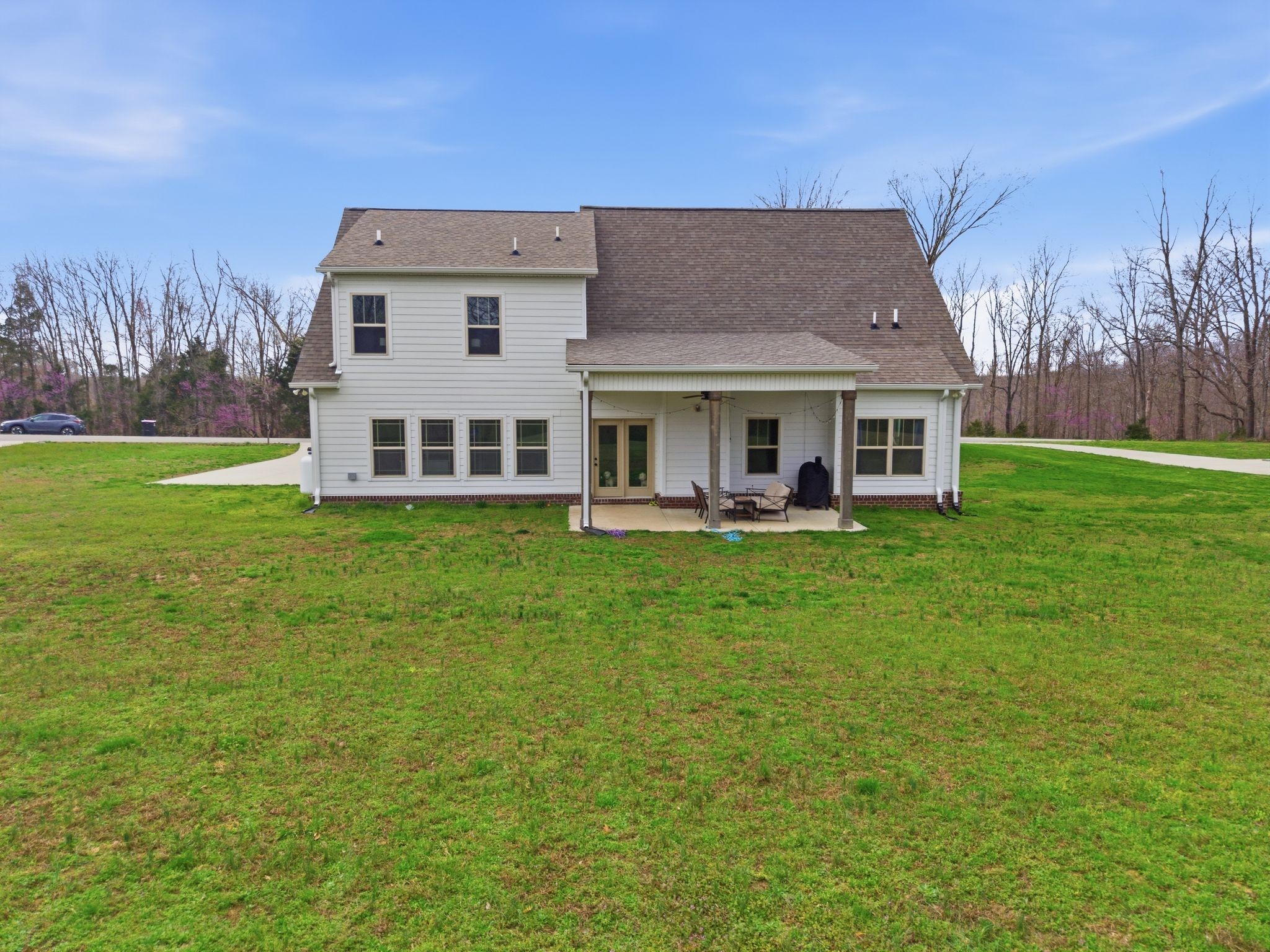 1166 Carney Winters Road Ashland City, TN 37015 - Photo 37 of 41 a view of a house with a backyard porch and sitting area