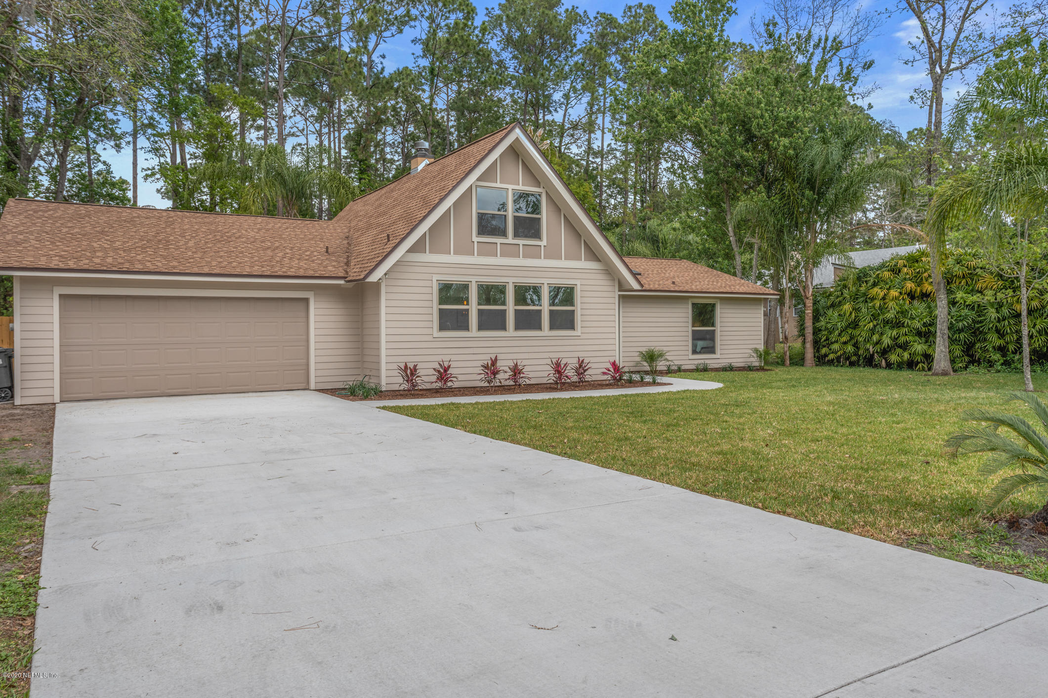1427 Satsuma Road St. Johns, FL 32259 - Photo 2 of 59 a front view of house with yard and green space