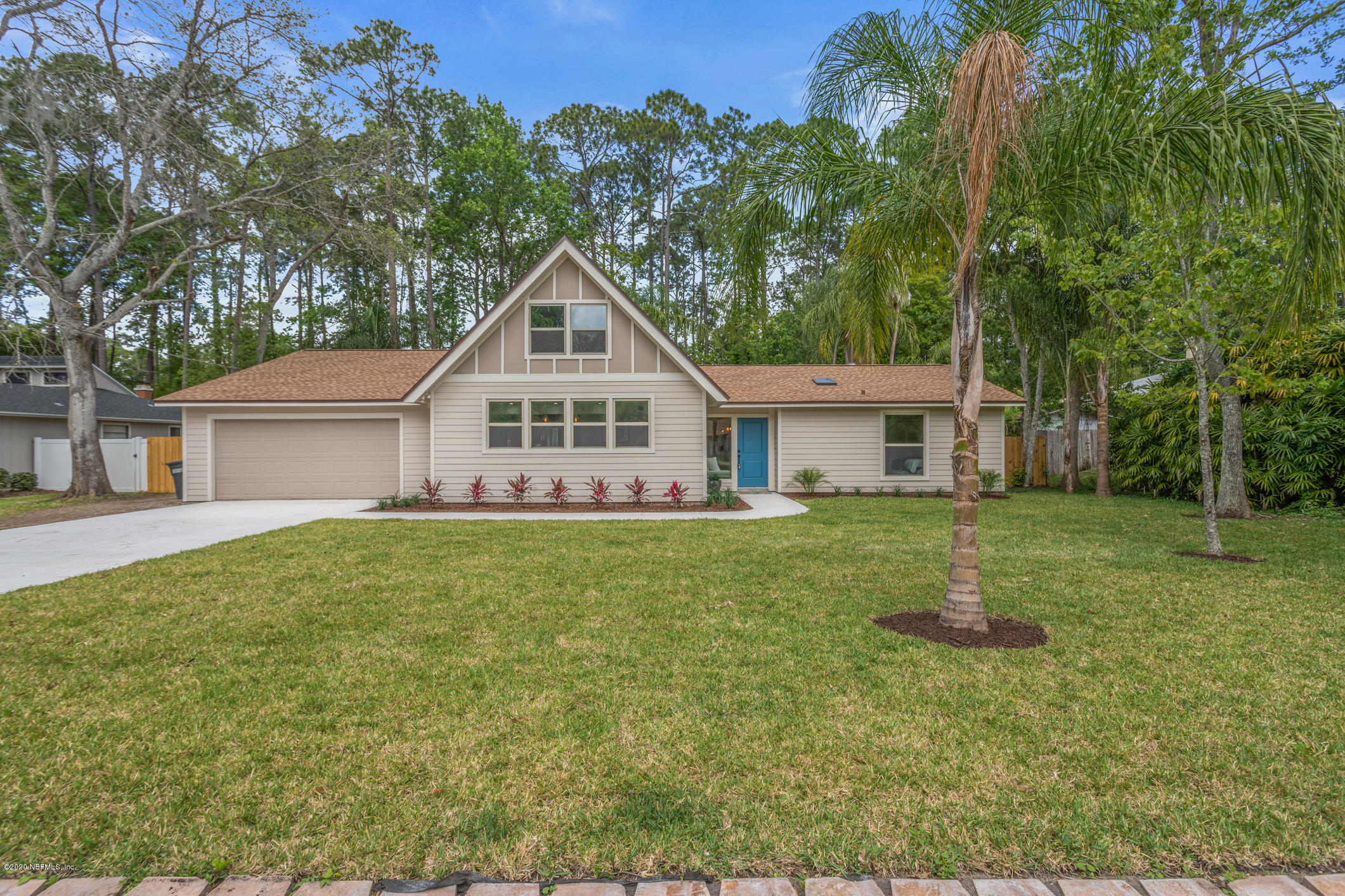 1427 Satsuma Road St. Johns, FL 32259 - Photo 3 of 59 a front view of a house with a yard