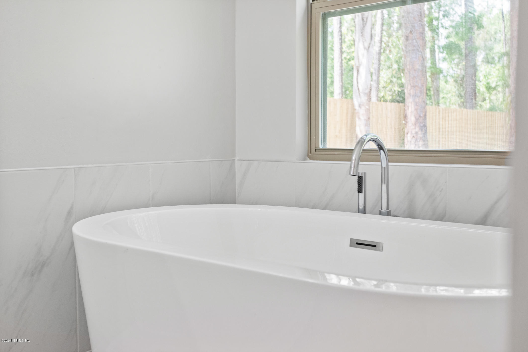 1427 Satsuma Road St. Johns, FL 32259 - Photo 33 of 59 a white bath tub sitting in a bathroom
