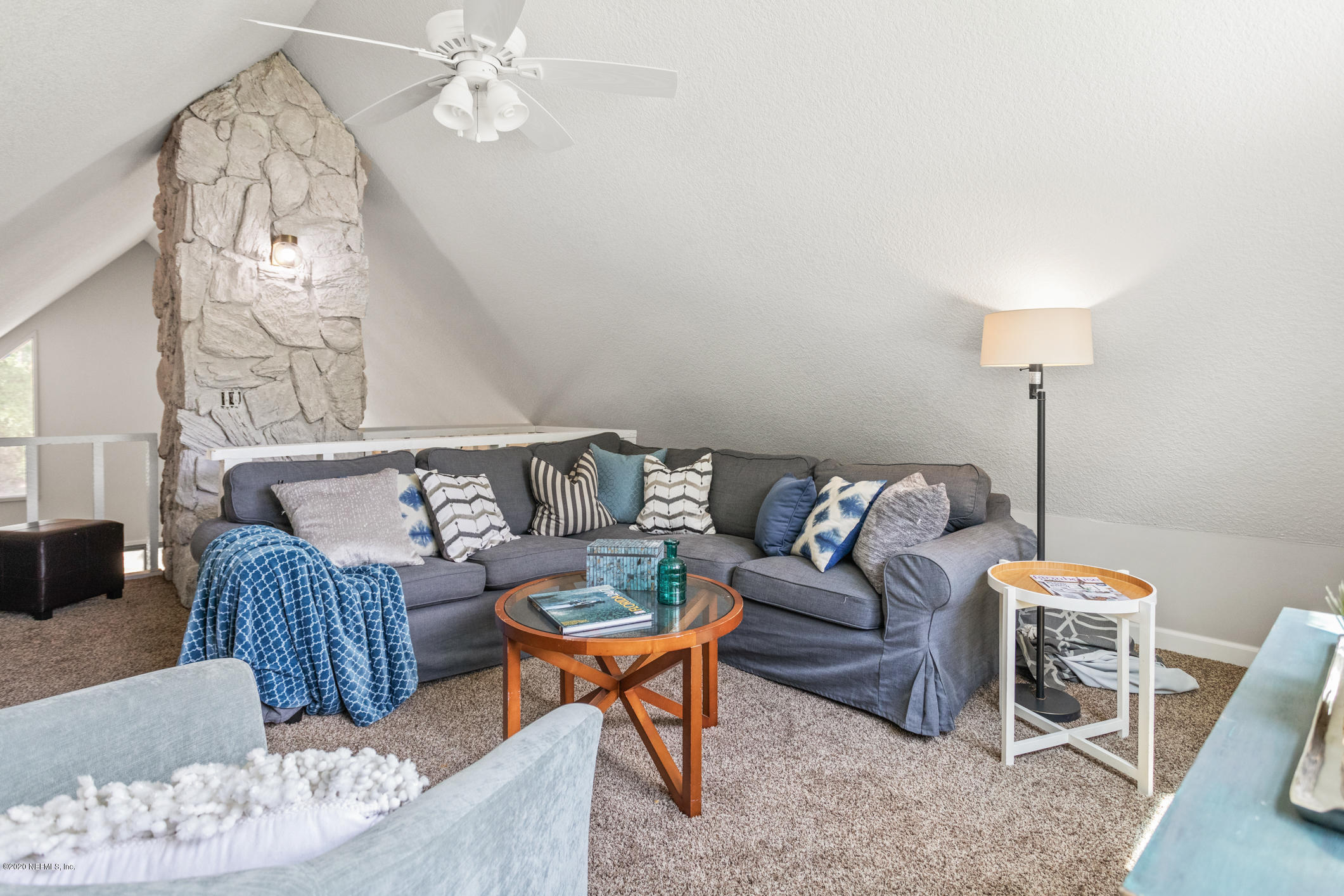 1427 Satsuma Road St. Johns, FL 32259 - Photo 50 of 59 a living room with furniture and a chandelier