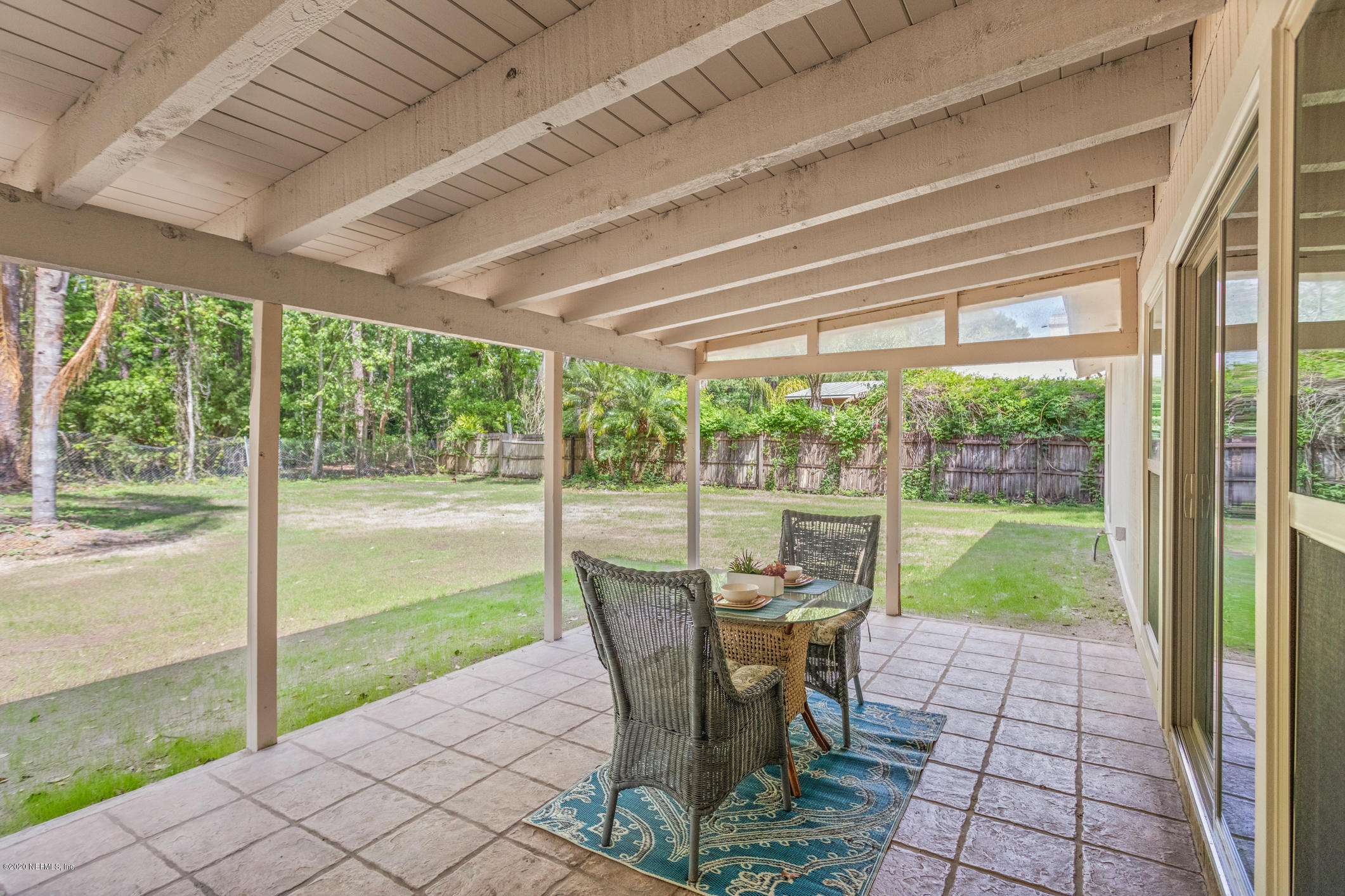 1427 Satsuma Road St. Johns, FL 32259 - Photo 54 of 59 a view of a porch with chairs and backyard