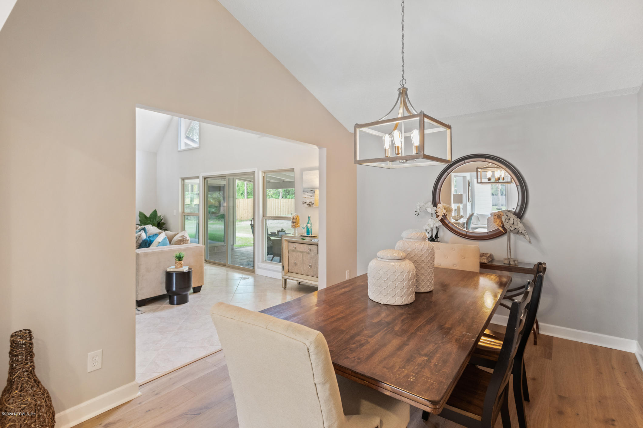 1427 Satsuma Road St. Johns, FL 32259 - Photo 9 of 59 a dining room with furniture a potted plant and wooden floor