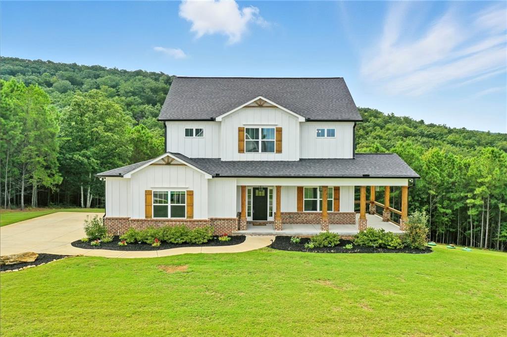 548 Stoneledge Road Jasper, GA 30143 - Photo 1 of 46 a front view of a house with a yard