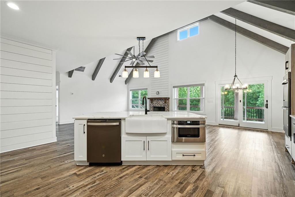 548 Stoneledge Road Jasper, GA 30143 - Photo 11 of 46 a kitchen with a stove and a microwave oven