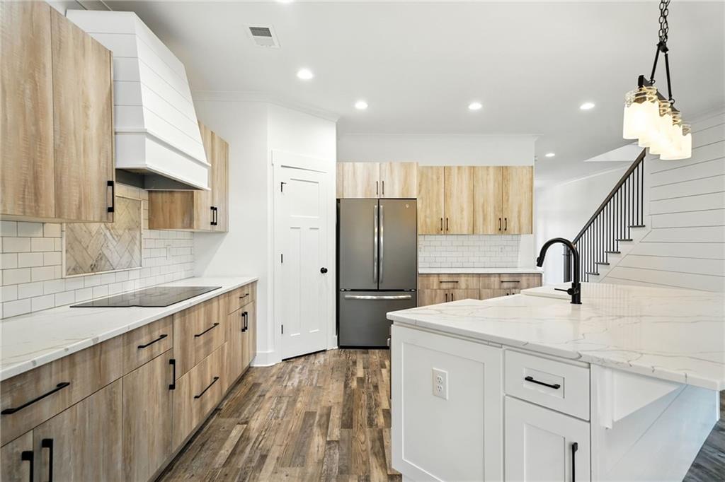 548 Stoneledge Road Jasper, GA 30143 - Photo 15 of 46 a kitchen with refrigerator cabinets and a sink