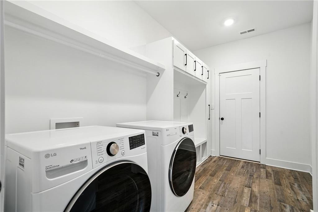 548 Stoneledge Road Jasper, GA 30143 - Photo 17 of 46 a view of washer and dryer with kitchen in the background