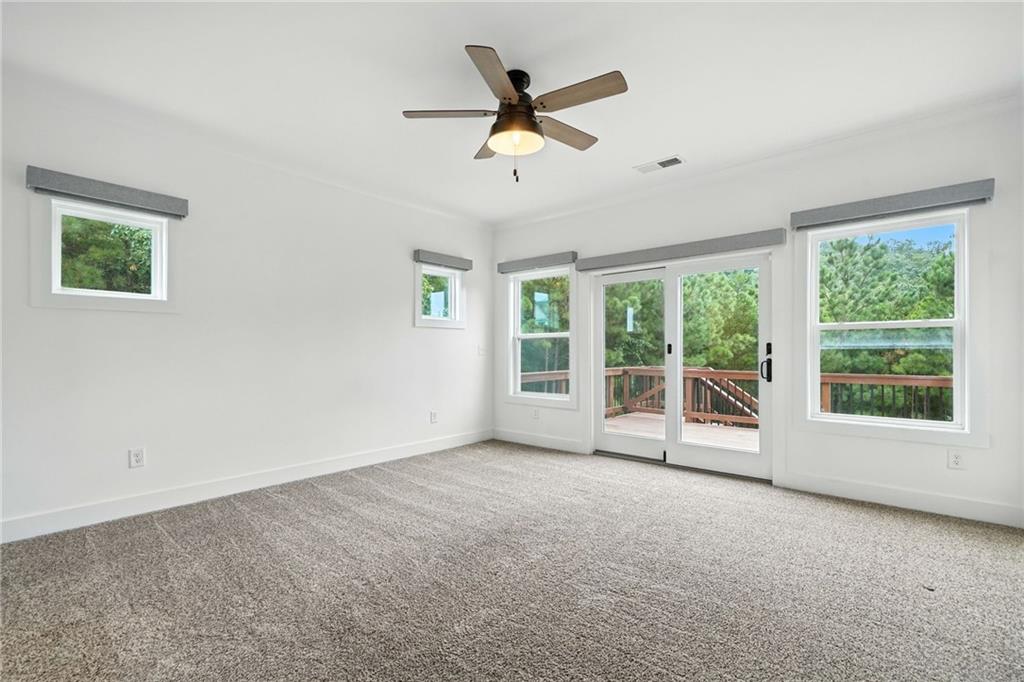 548 Stoneledge Road Jasper, GA 30143 - Photo 18 of 46 a view of a livingroom with a ceiling fan and window