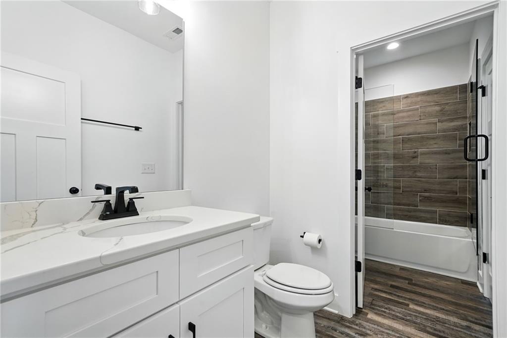 548 Stoneledge Road Jasper, GA 30143 - Photo 25 of 46 a bathroom with a sink a toilet and shower