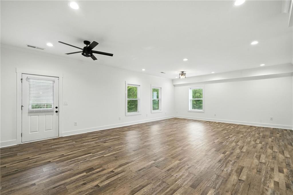 548 Stoneledge Road Jasper, GA 30143 - Photo 27 of 46 a view of empty room with wooden floor and ceiling fan