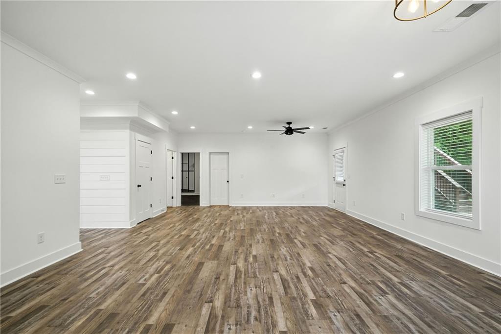 548 Stoneledge Road Jasper, GA 30143 - Photo 28 of 46 a view of empty room with wooden floor and fan