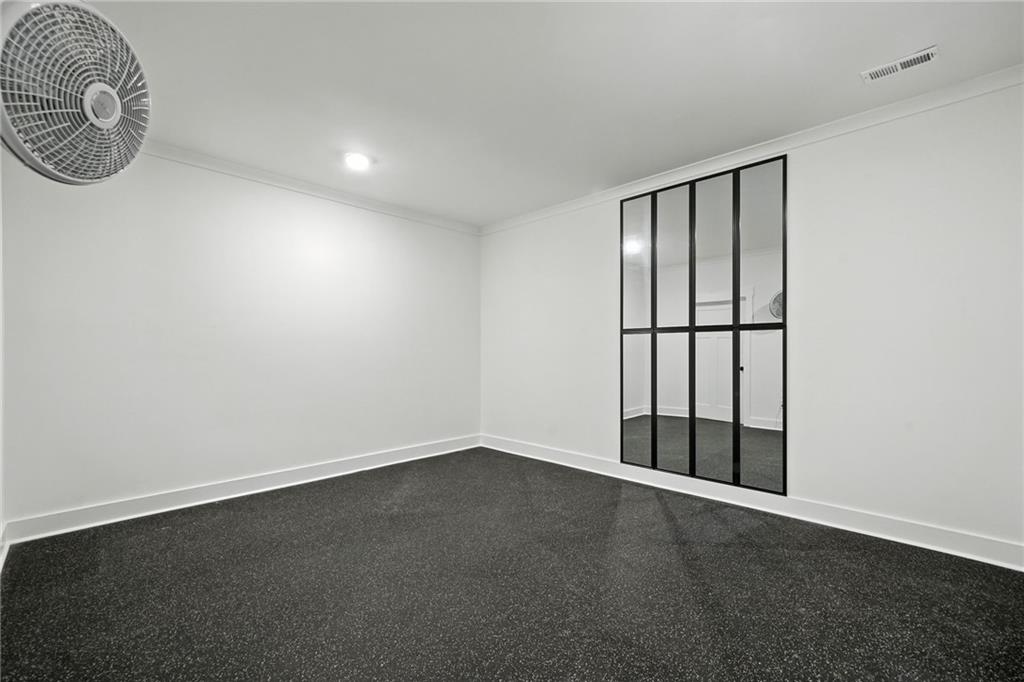 548 Stoneledge Road Jasper, GA 30143 - Photo 30 of 46 an empty room with a window