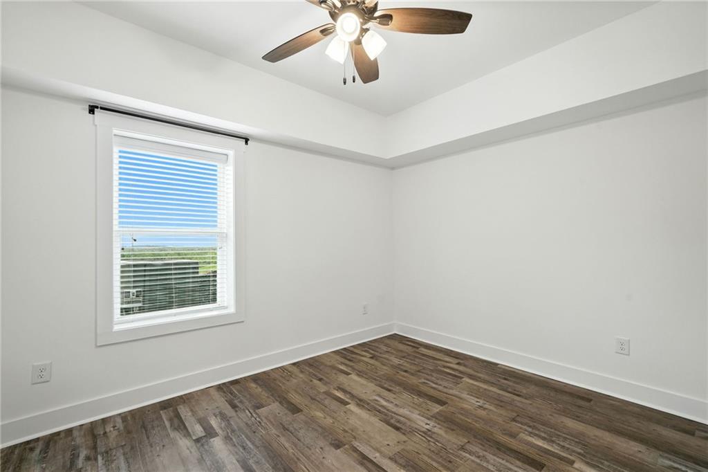 548 Stoneledge Road Jasper, GA 30143 - Photo 31 of 46 a view of an empty room with wooden floor and a window