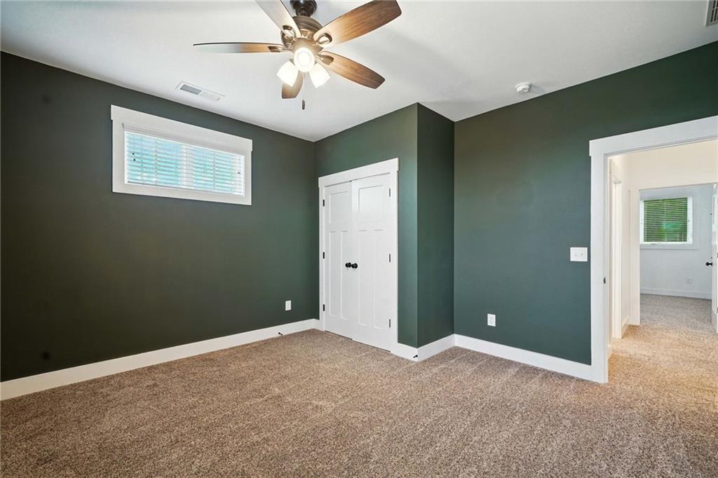 548 Stoneledge Road Jasper, GA 30143 - Photo 33 of 46 an empty room and chandelier fan