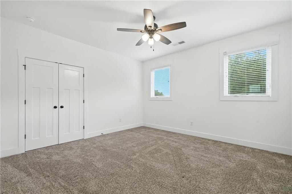 548 Stoneledge Road Jasper, GA 30143 - Photo 36 of 46 a view of an empty room with a window