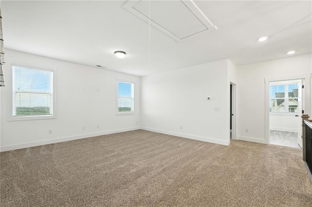 548 Stoneledge Road Jasper, GA 30143 - Photo 38 of 46 an empty room with windows and closet