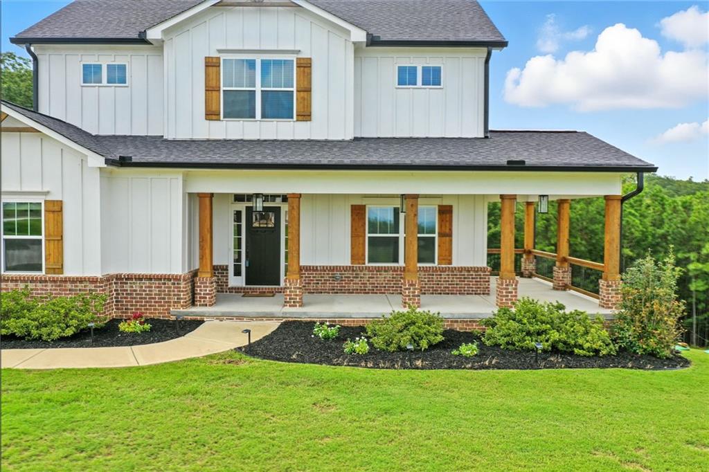 548 Stoneledge Road Jasper, GA 30143 - Photo 5 of 46 a front view of a house with a yard