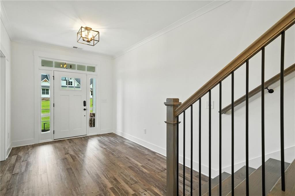 548 Stoneledge Road Jasper, GA 30143 - Photo 7 of 46 a view of an entryway with wooden floor and stairs