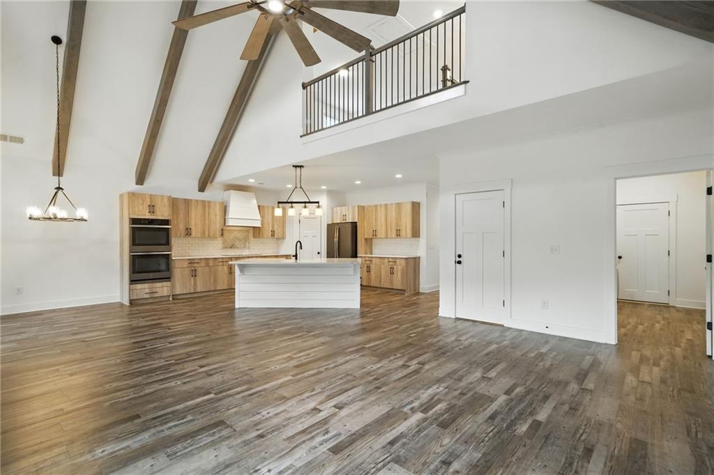 548 Stoneledge Road Jasper, GA 30143 - Photo 9 of 46 a view of empty room with wooden floor