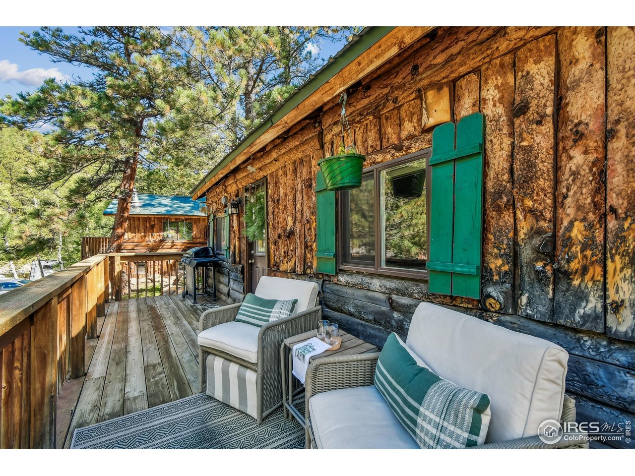 541 Riverside Drive Lyons, CO 80540 - Photo 30 of 45 a balcony with table and chairs
