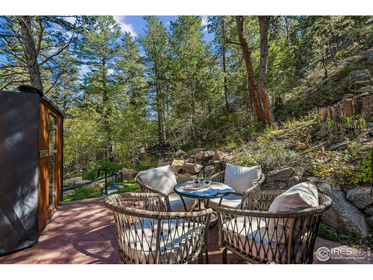 541 Riverside Drive Lyons, CO 80540 - Photo 40 of 45 a view of a chairs and table in the backyard