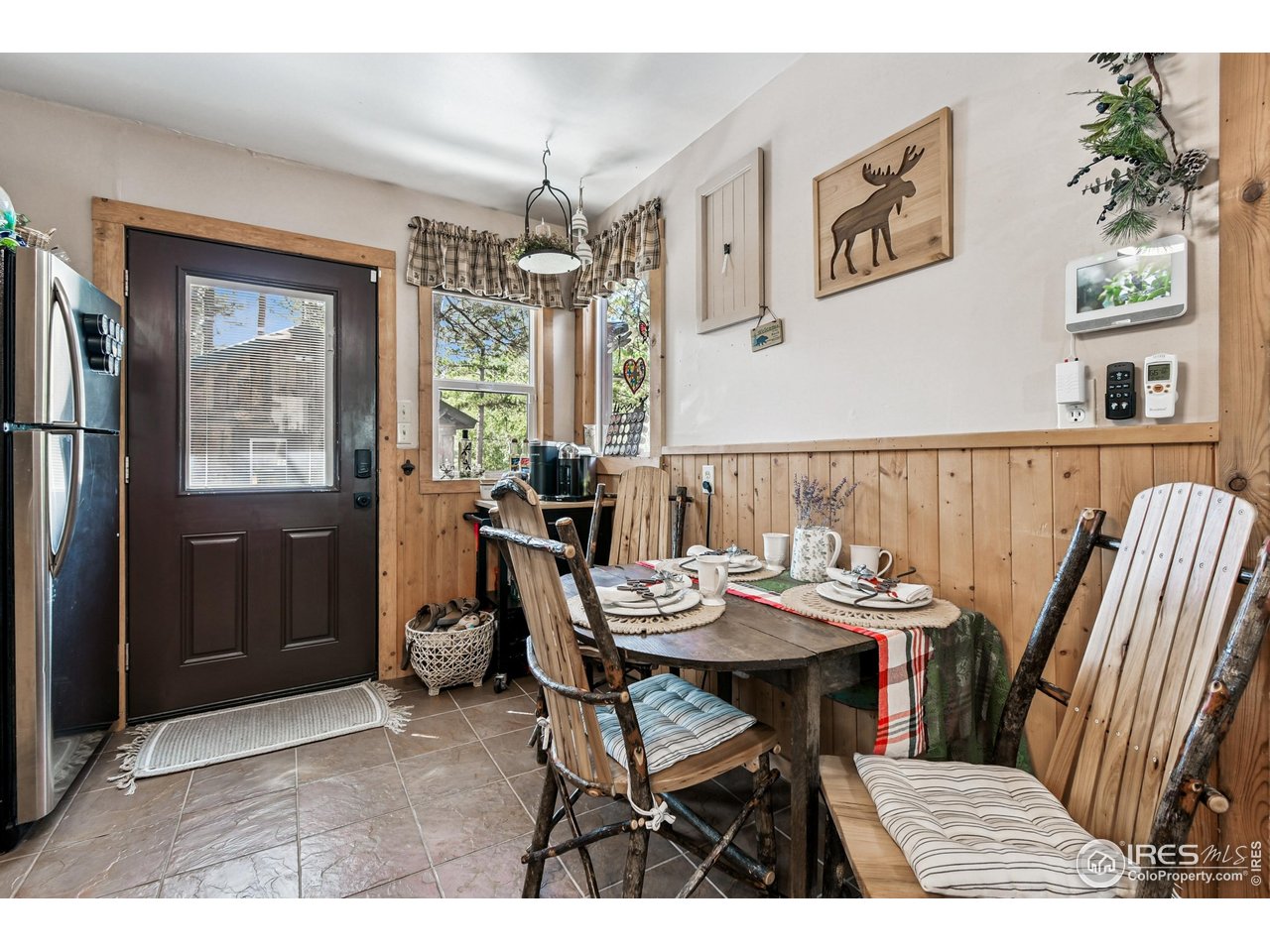 541 Riverside Drive Lyons, CO 80540 - Photo 7 of 45 a view of a dining room with furniture window and outside view