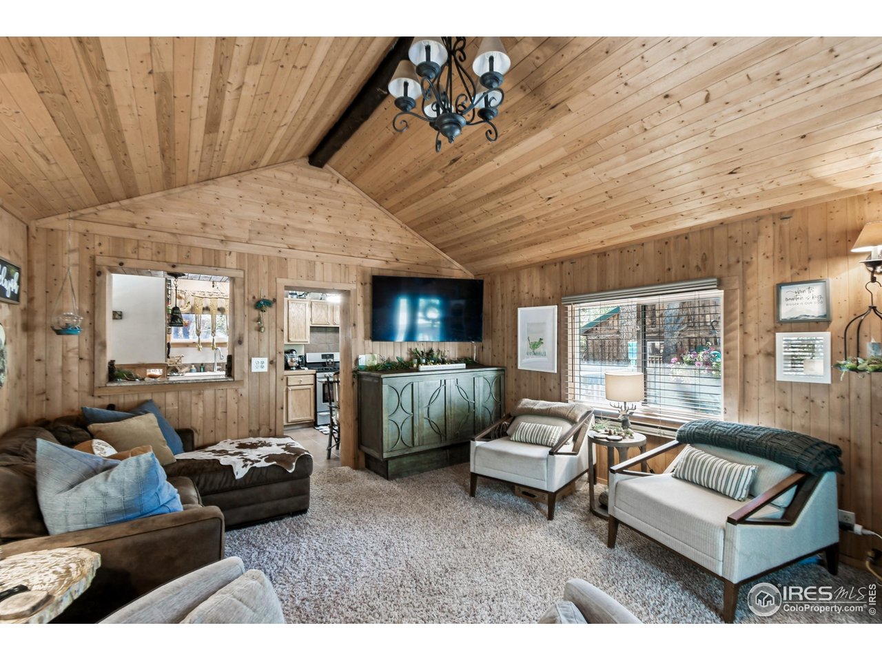 541 Riverside Drive Lyons, CO 80540 - Photo 8 of 45 a living room with furniture and a large window