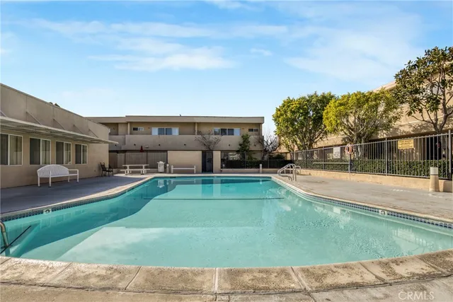 a view of a swimming pool with a yard