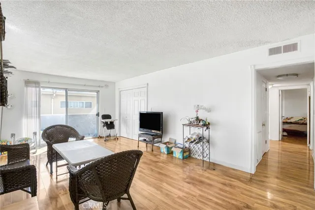 a view of a livingroom with furniture and a flat screen tv
