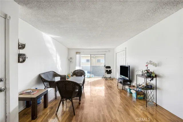 a living room with furniture flat screen tv and a fireplace