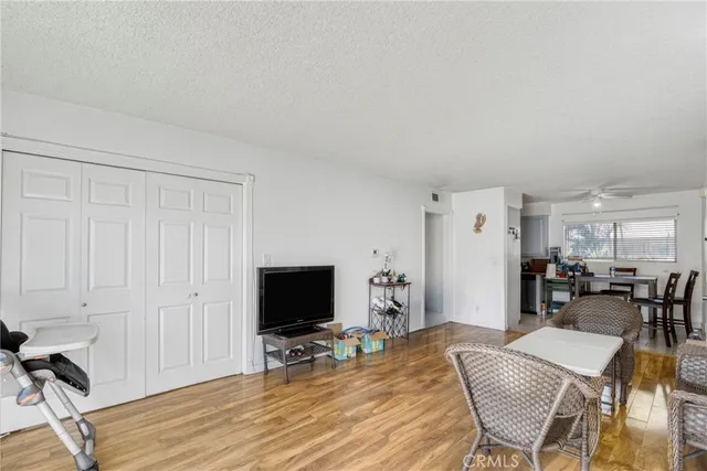 a view of a livingroom with furniture and a flat screen tv