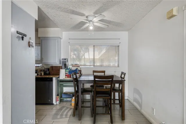 a view of a dining room with furniture and window