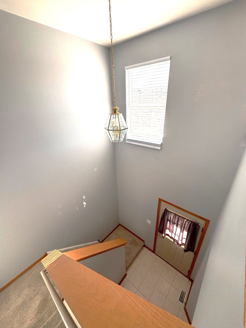 655 Chestnut Ridge Minooka, IL 60447 - Photo 11 of 21 a view of an empty room and window
