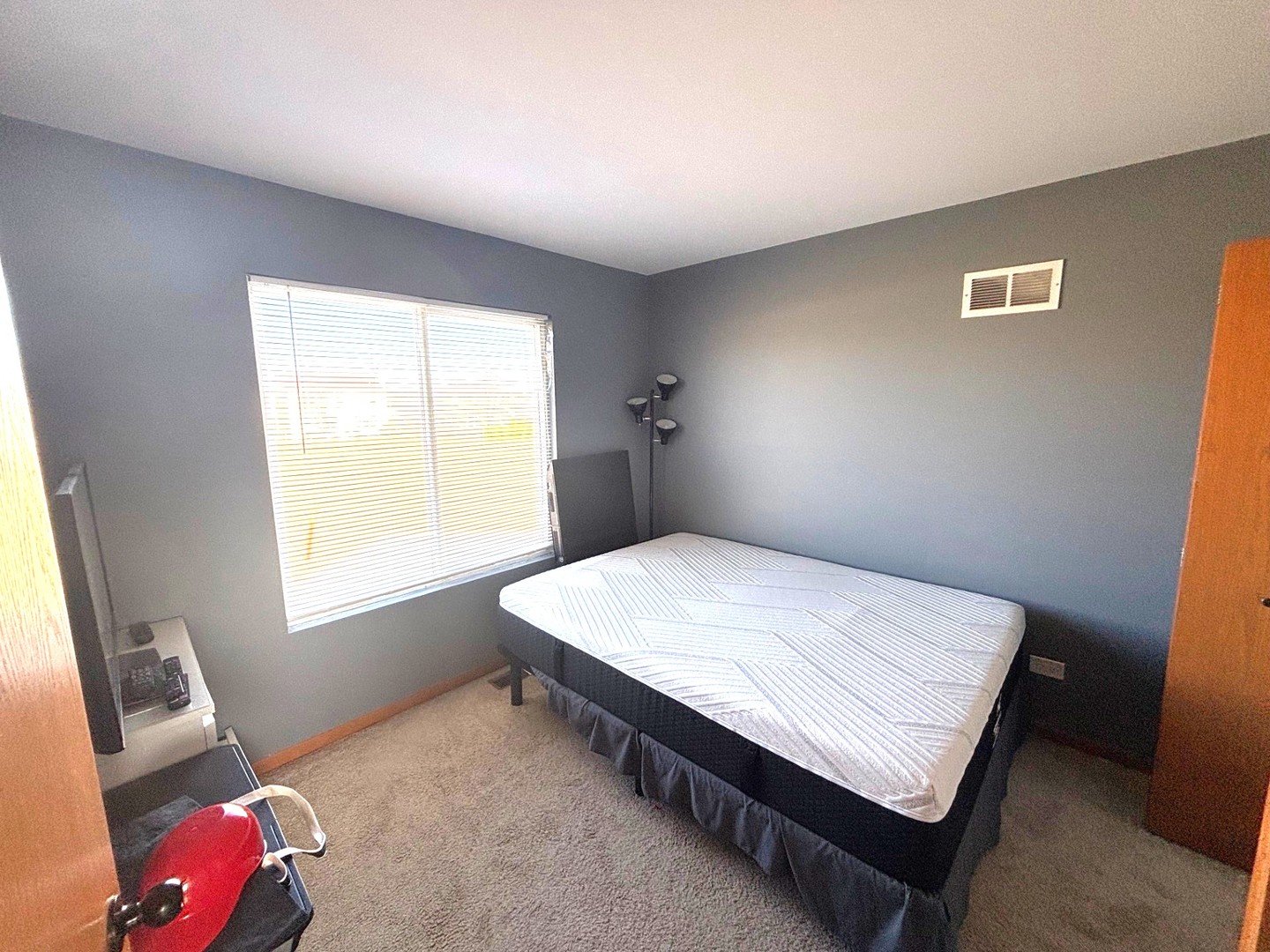 655 Chestnut Ridge Minooka, IL 60447 - Photo 13 of 21 a bed room with a bed and a window